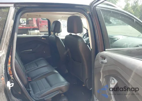 2016 Ford Escape Titanium z USA, uszkodzony, nr VIN 1FMCU9JX1GUC18335